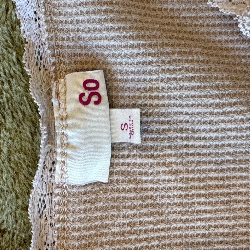 Beige cropped v neck with floral design around neck